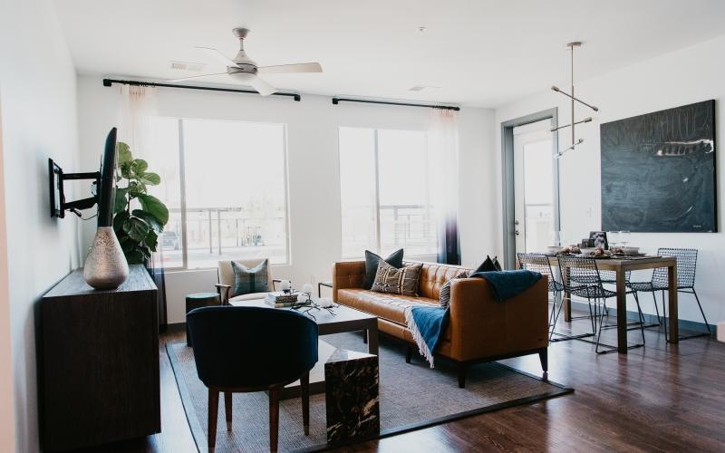 a living room with a couch and chairs