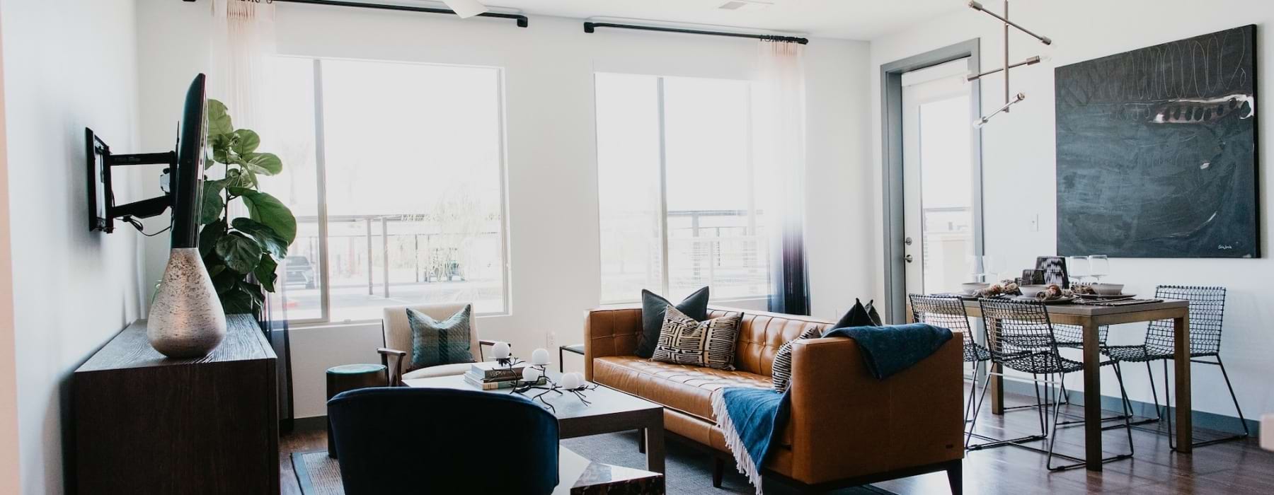 a living room with a couch and chairs