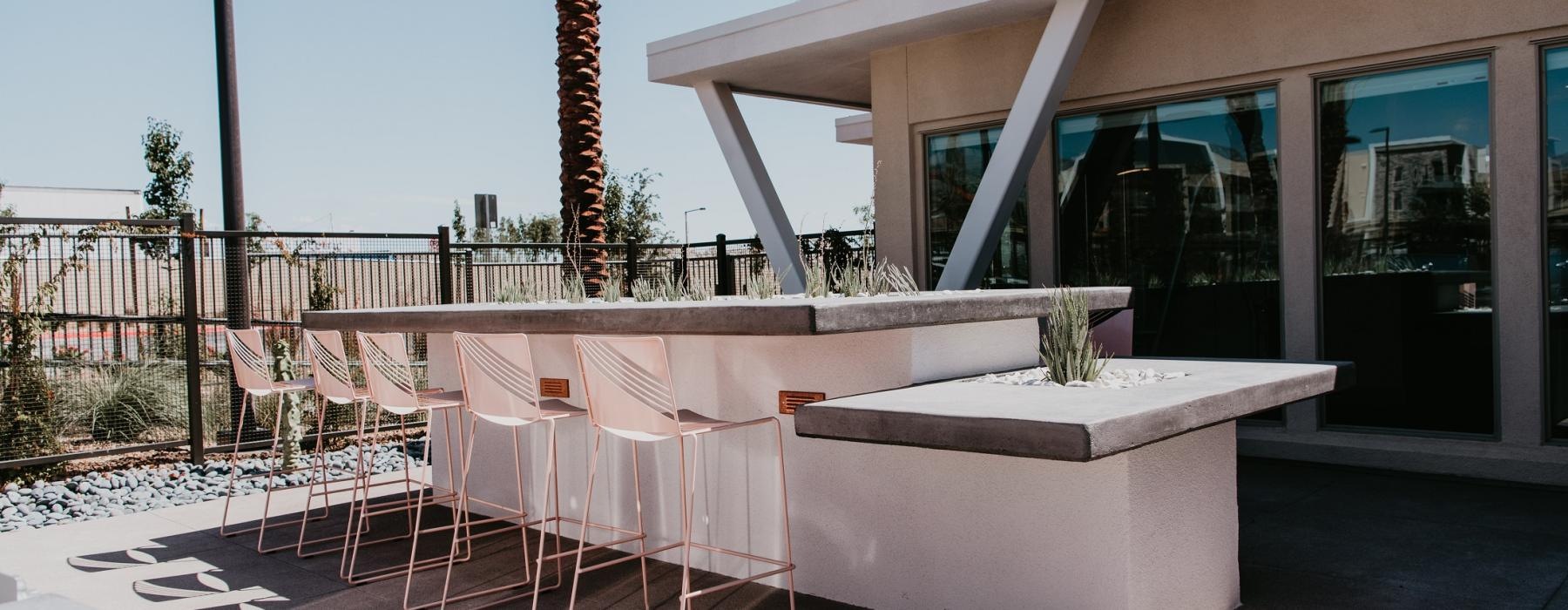 a patio with tables and chairs