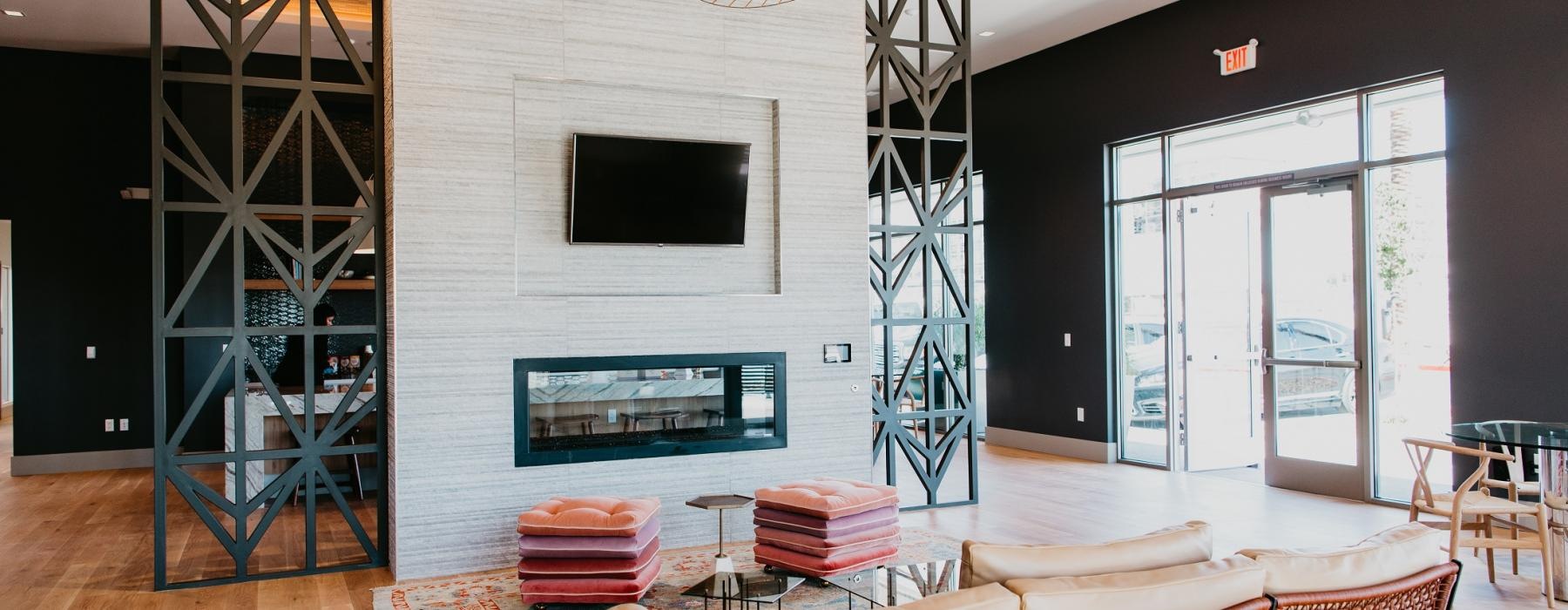 a room with a fireplace and chairs