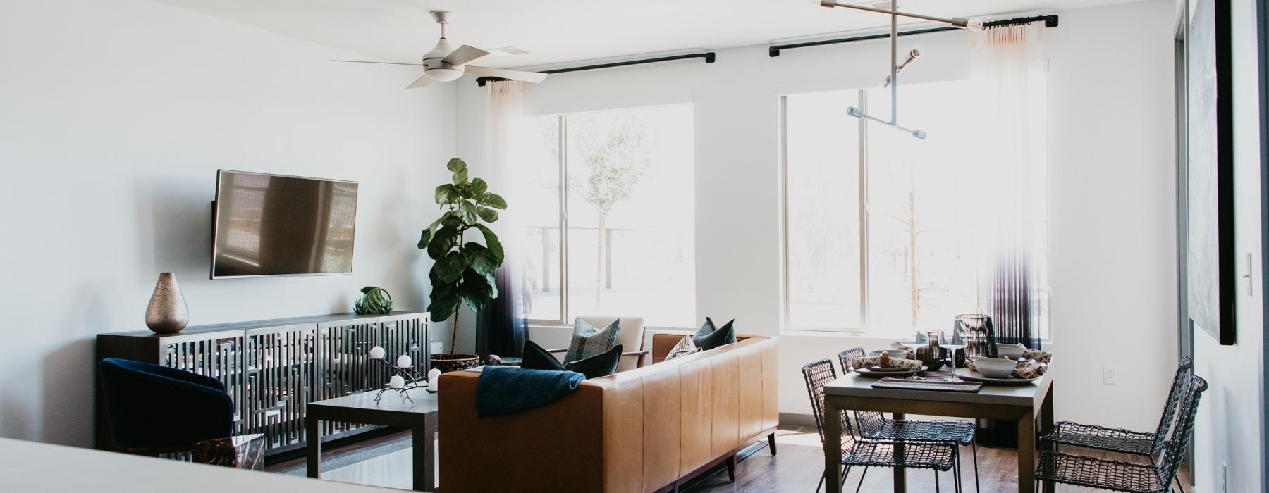 a living room with a couch and chairs