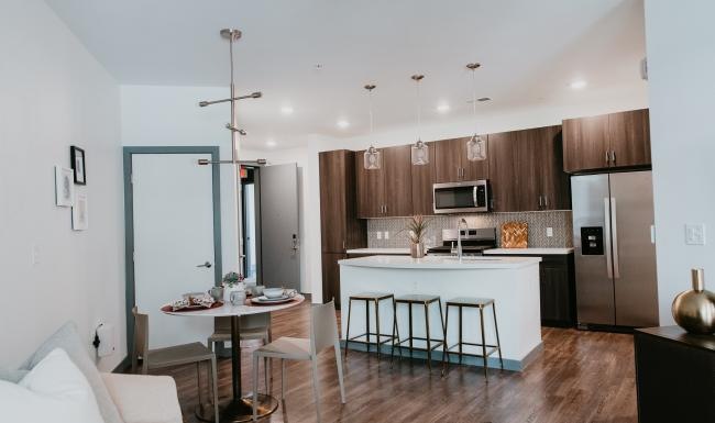 a kitchen with a dining table and chairs